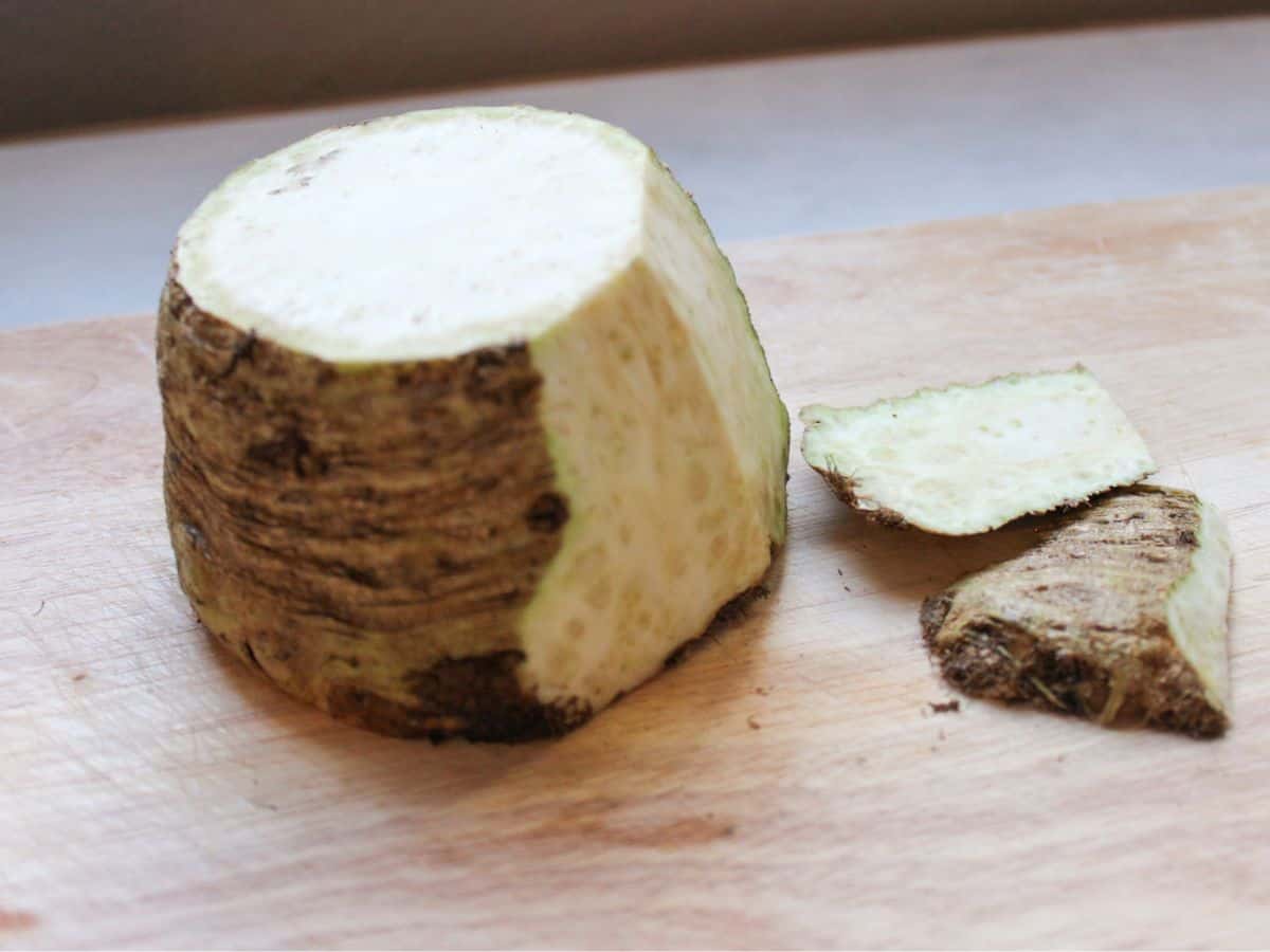 Celeriac with tops cut off and few strips of skin peeled.